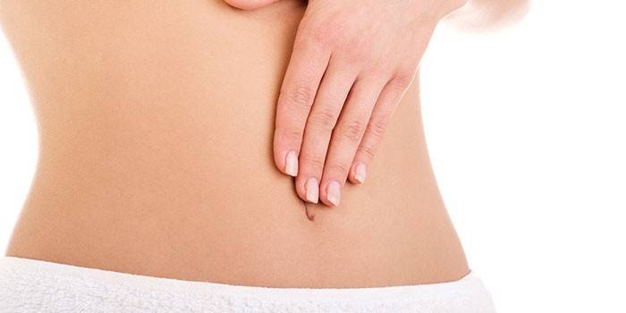 Біль в області пупка у жінок — причини і супутні симптоми